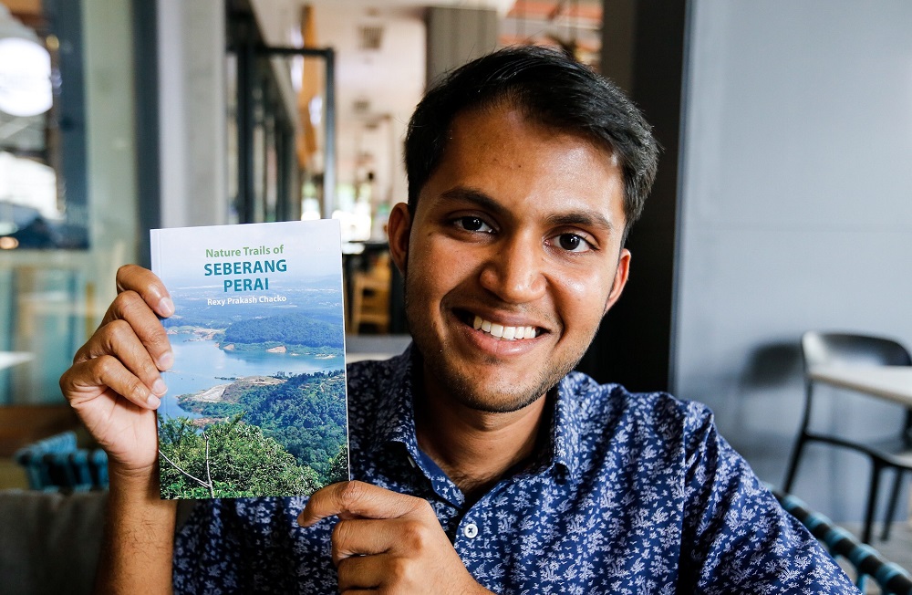 Rexy Prakash Chacko showing his book, the Nature Trail of Seberang Perai which provide detail information and guide on the Seberang Perai area for the nature lover. u00e2u20acu201d Picture by Sayuti Zainudin