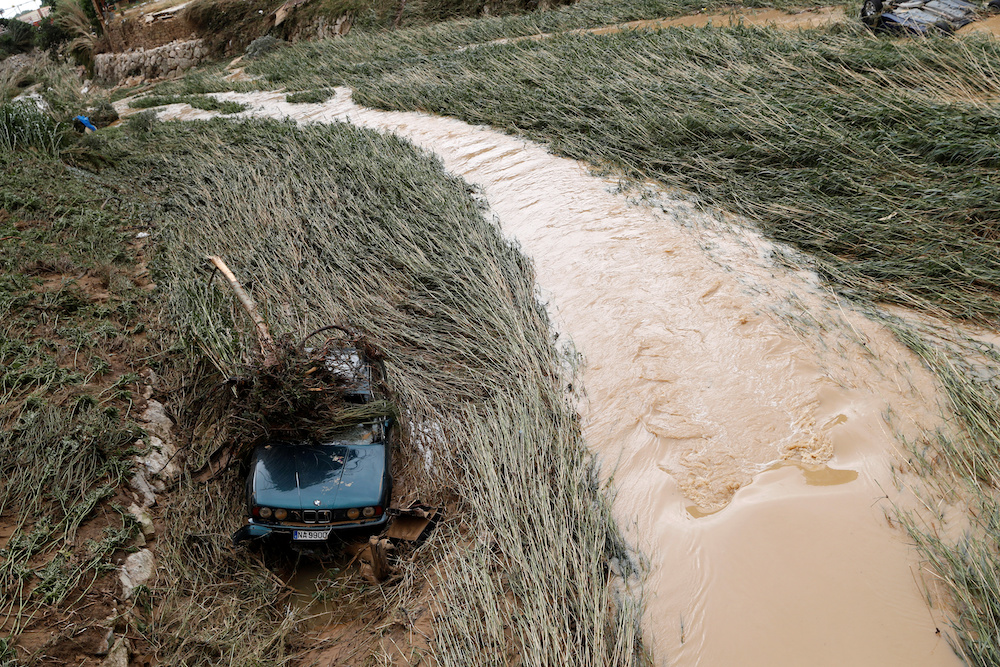 A car lays on the riverbank after heavy rainfall in Tafalla, Spain, July 9, 2019. u00e2u20acu201d AFP picnn