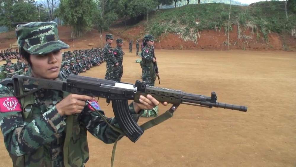 A female member of the Arakan Army holding an assault rifle during a training session. u00e2u20acu2022 TODAY pic
