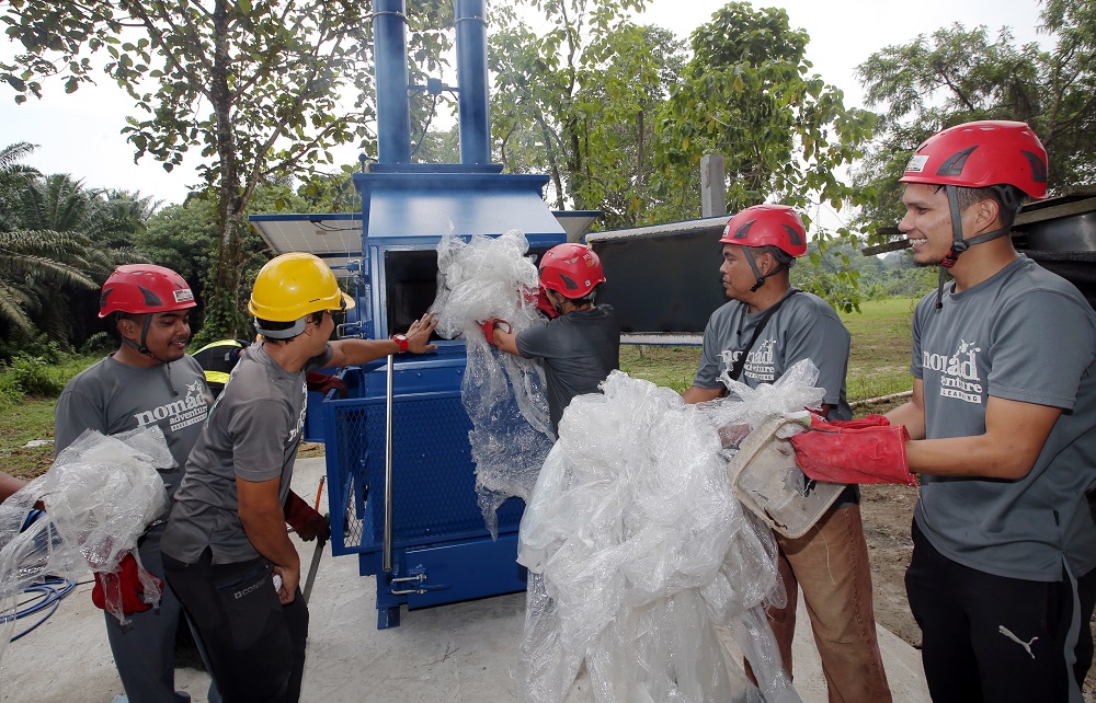 The Nomad Adventure team and the waste disposal system called the Asher. u00e2u20acu201d Picture by Farhan Najib