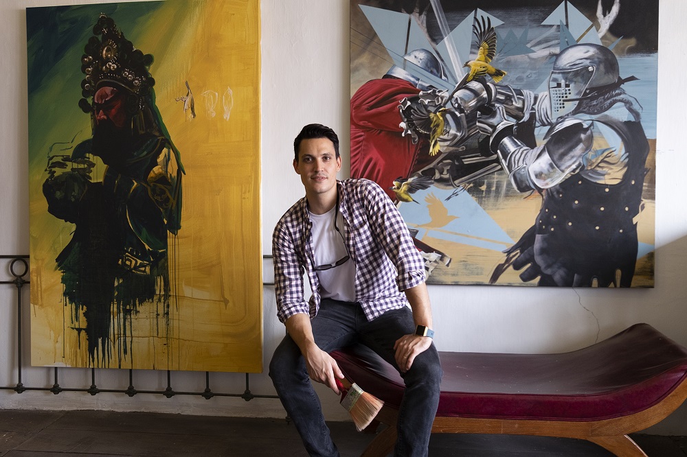 Artist Thomas Powell with his distinctive paintings. u00e2u20acu201d Pictures by Steven Ooi KE