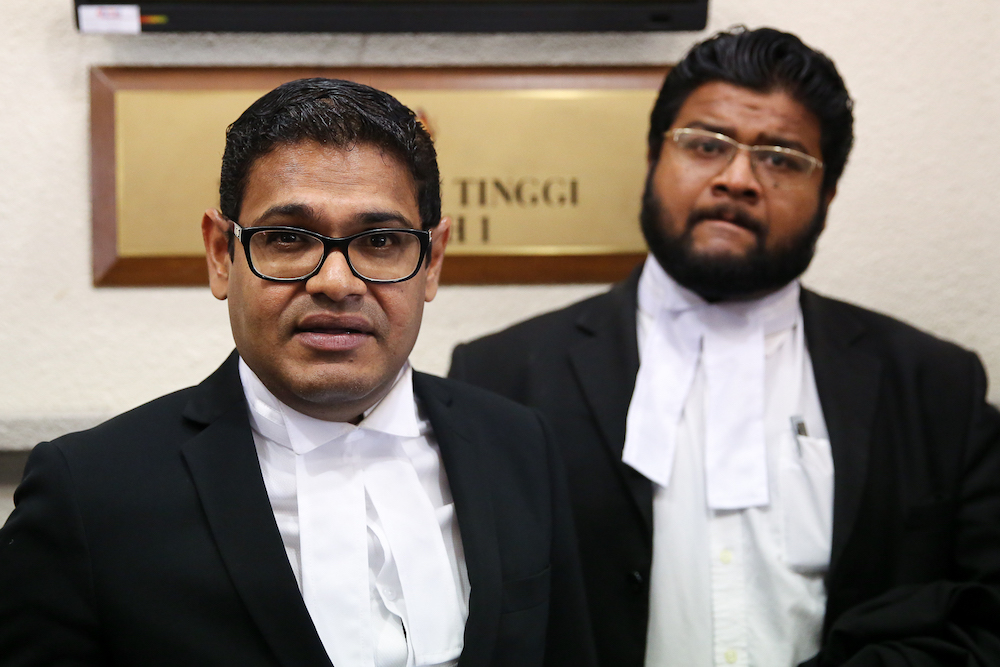 Lawyer Ramesh Sivakumar (left) speaks to reporters at the Kuala Lumpur High Court July 17, 2019. u00e2u20acu201d Picture by Yusof Mat Isa
