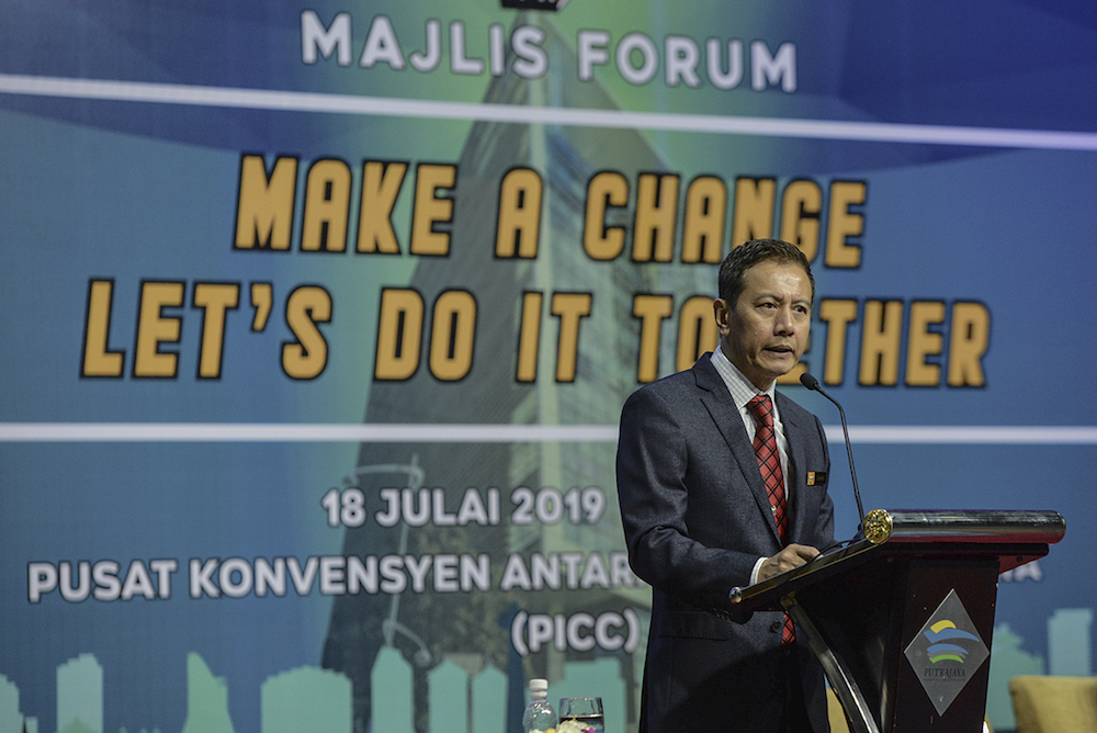 Election Commission chairman Azhar Azizan Harun delivers his speech during the u00e2u20acu02dcMake A Change, Letu00e2u20acu2122s Do It Togetheru00e2u20acu2122 in Putrajaya July 18, 2019. u00e2u20acu201d Picture by Shafwan Zaidon