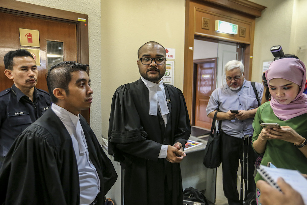 Deputy Public Prosecutor Aaron Chelliah speaks to reporters about the forfeiture action of RM48 million by the government on Tan Sri Larry Low Hock Peng in the High Court in Kuala Lumpur July 19, 2019. u00e2u20acu201d Picture by Firdaus Latif