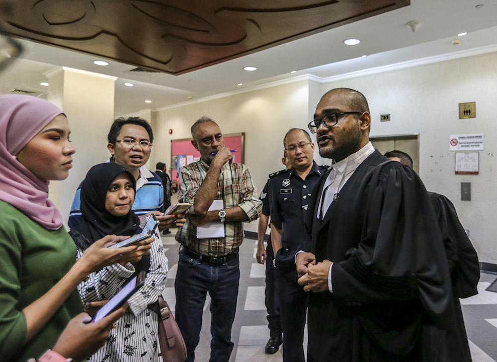 Deputy Public Prosecutor Aaron Chelliah speaks to reporters about the forfeiture action of RM48 million by the government on Tan Sri Larry Low Hock Peng in the High Court in Kuala Lumpur July 19, 2019. u00e2u20acu201d Picture by Firdaus Latif