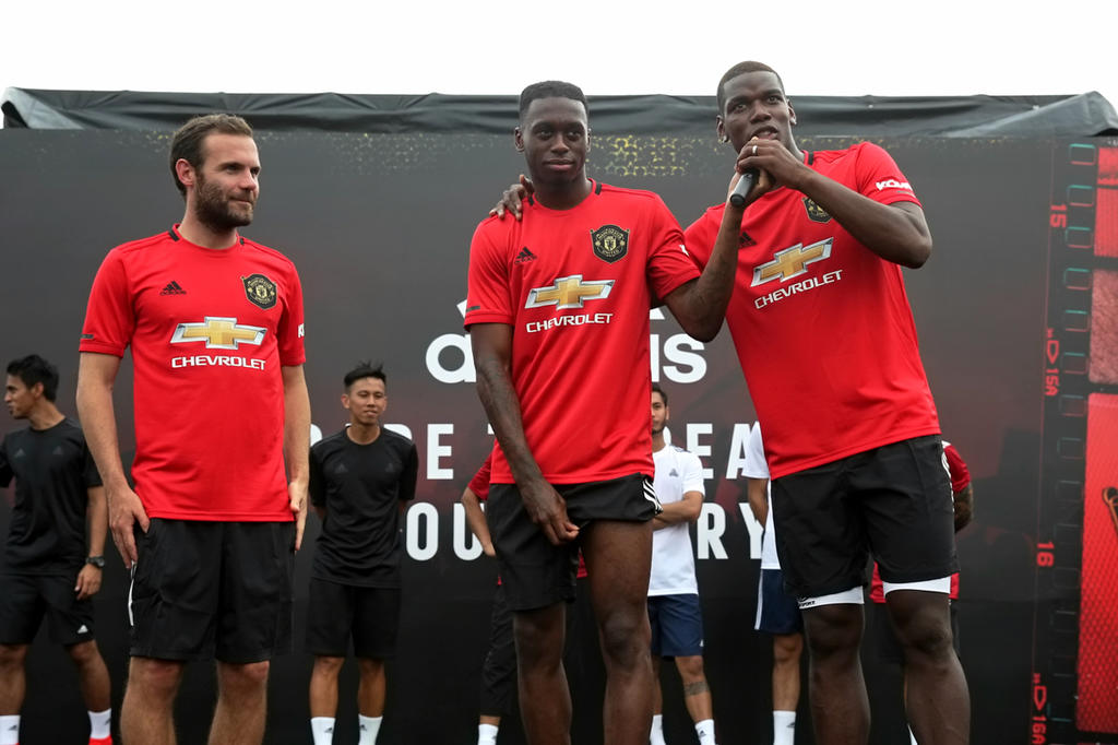 Manchester United stars Juan Mata, Aaron Wan-Bissaka and Paul Pogba greet their fans at the floating platform at Marina Bay in Singapore July 21, 2019. u00e2u20acu201d TODAY pic