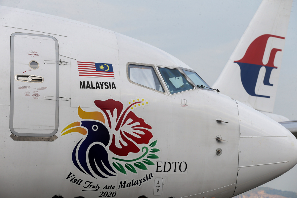 The Visit Malaysia Year 2020 logo is seen on an aircraft at the Bunga Raya Complex, Sepang July 22, 2019. u00e2u20acu201d Picture by Ahmad Zamzahuri