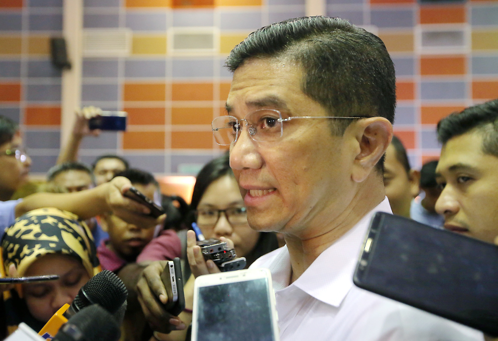 Economic Affairs Minister Datuk Seri Azmin Ali speaks to the press after visiting Felcra residents at the Dewan Besar Seberang Perak, Kampung Gajah July 22, 2019. u00e2u20acu201d Picture by Farhan Najib