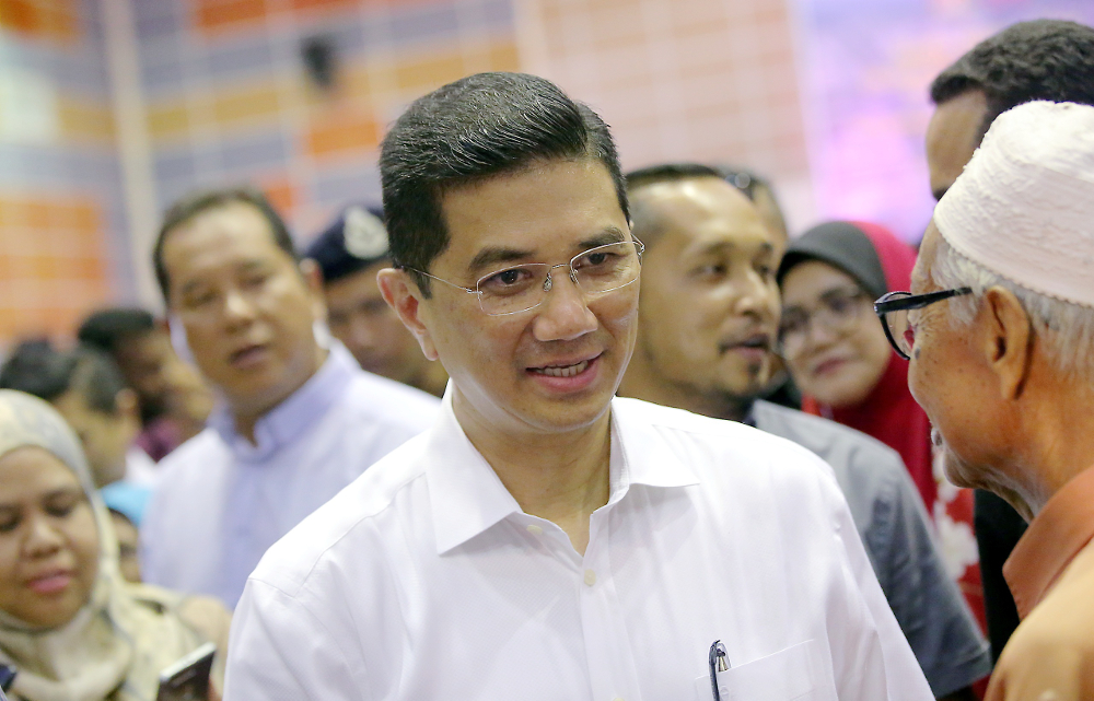 Economic Affairs Minister Datuk Seri Azmin Ali speaks to the press after visiting Felcra residents at the Dewan Besar Seberang Perak, Kampung Gajah July 22, 2019. u00e2u20acu201d Picture by Farhan Najib