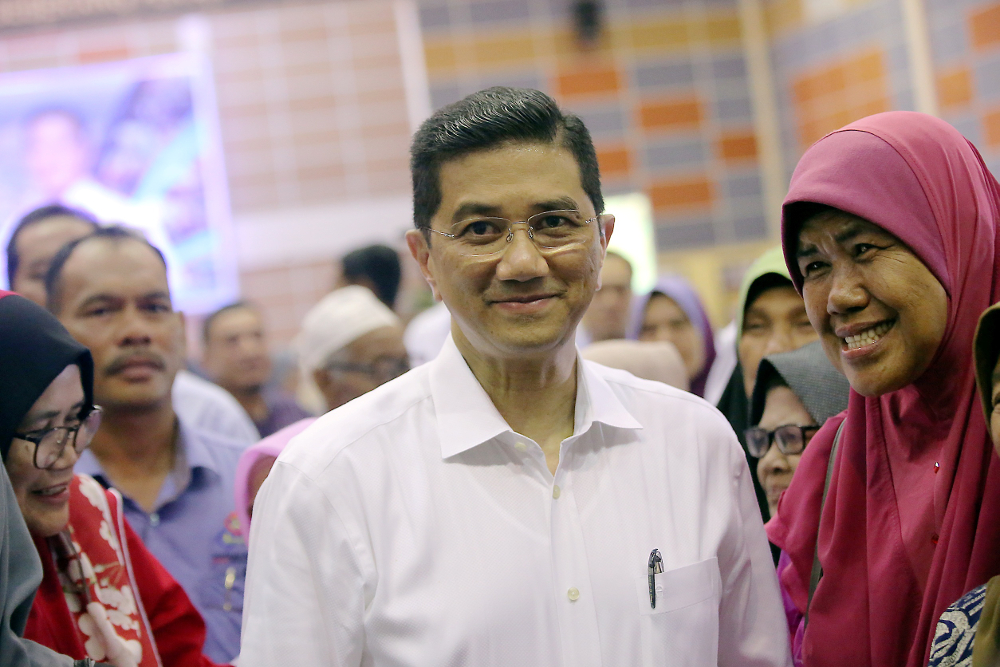 Economic Affairs Minister Datuk Seri Azmin Ali speaks to the press after visiting Felcra residents at the Dewan Besar Seberang Perak, Kampung Gajah July 22, 2019. u00e2u20acu201d Picture by Farhan Najib