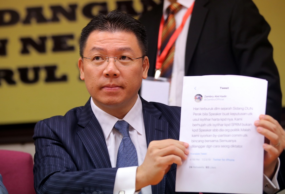 Perak DAP chairman Nga Kor Ming holds up a printout of former Perak mentri besar Datuk Seri Zambry Abdul Kadiru00e2u20acu2122s Twitter post at a press conference in Ipoh July 25, 2019. u00e2u20acu201d Picture by Farhan Najib