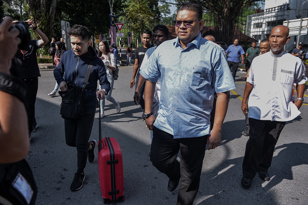 Umno Supreme Council member Datuk Lokman Noor Adam arrives at the Bukit Aman Police headquarters in Kuala Lumpur July 26, 2019. u00e2u20acu201d Picture by Mukhriz Hazim
