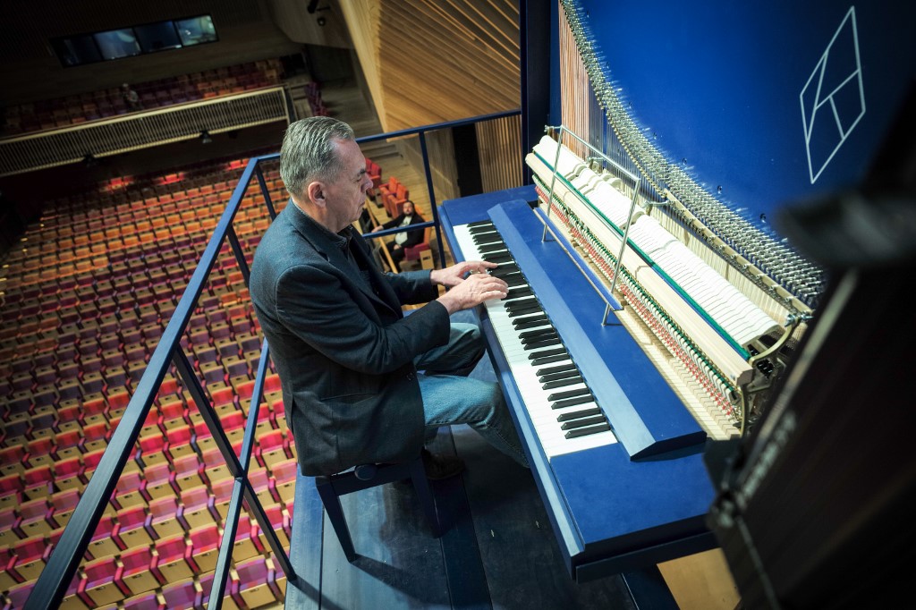 Piano constructor and builder David Klavins plays his new creation, the M470i vertical concert grand piano, with a height of 4,70 metres, at the new Lativa concert hall in Ventspils, Latvia, on July 23, 2019. u00e2u20acu201d AFP picnn