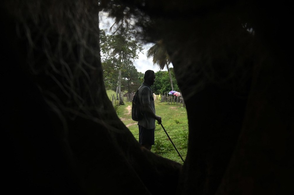 Disabled diver Jaime Lemus Matute, 60, looks at the camera on his way home in Prumnitara, Puerto Lempira, Honduras, on July 8, 2019. u00e2u20acu201d AFP picnn