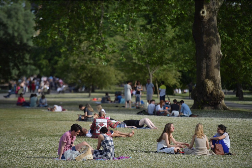 People relax in the warm weather in Regents Park in London on June 1, 2019. u00e2u20acu201d AFP pic 