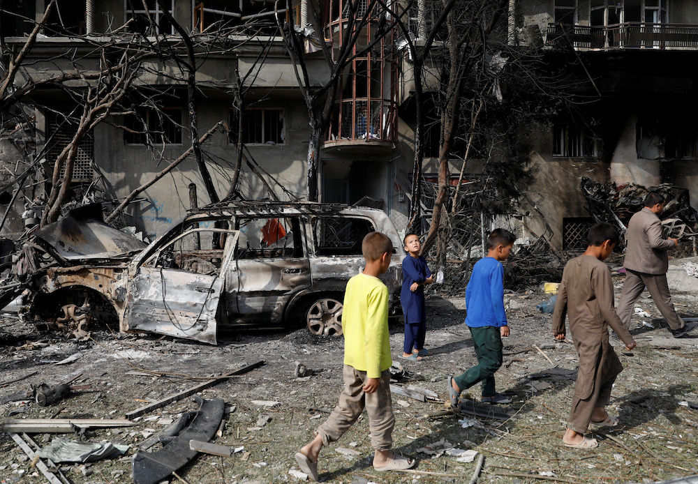 Afghan boys walk at the site of the attack in Kabul, Afghanistan July 29, 2019. u00e2u20acu201d Reuters picnn