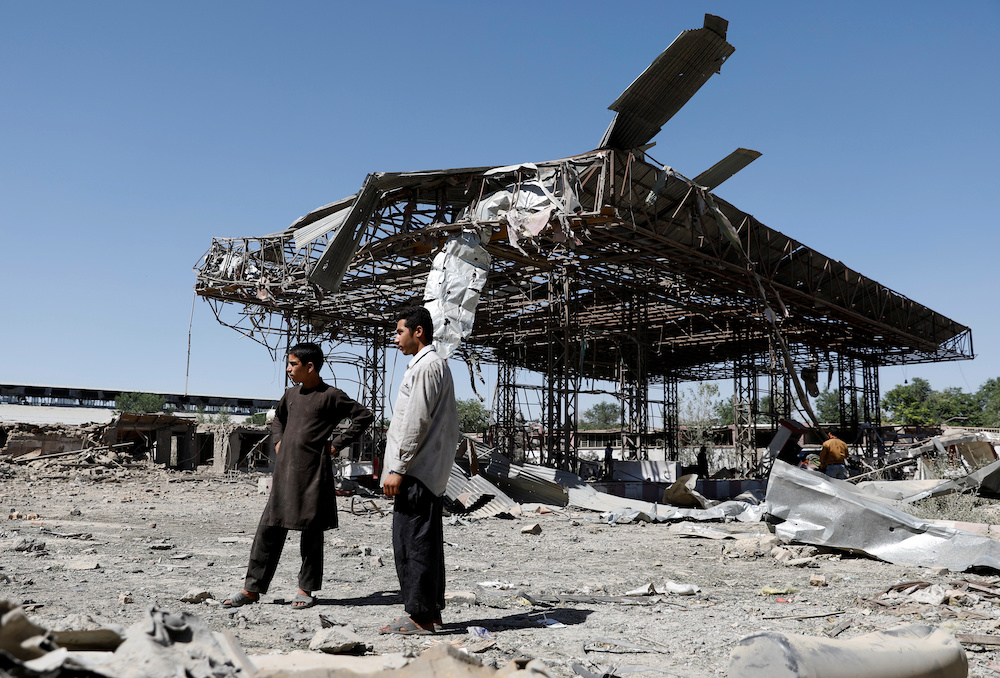 File photo of men standing at the site of a blast in Kabul, Afghanistan July 2, 2019. u00e2u20acu201d Reuters picnn
