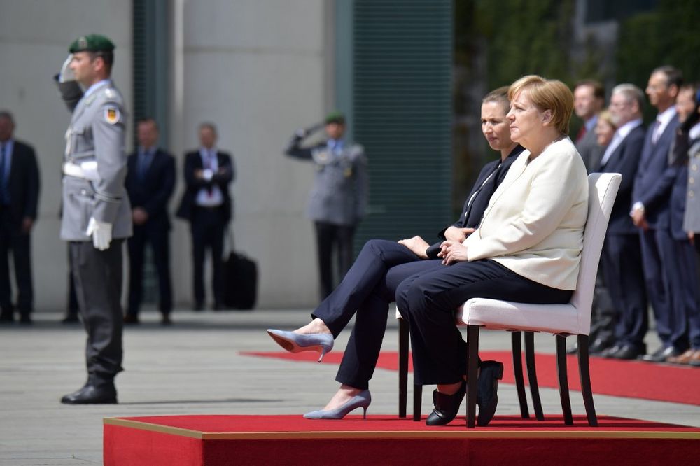 German Chancellor Angela Merkel (right) and Denmarku00e2u20acu2122s Prime Minister Mette Frederiksen sit as they listen to the national anthems during a welcoming ceremony with military honours, July 11, 2019 in the courtyard of the Chancellery in Berlin. u00e2u20acu201d AFP pic
