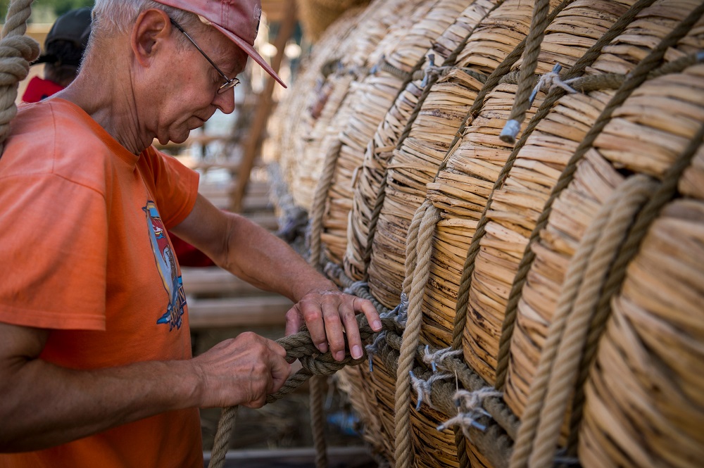 A member of the crew assembles the 14 metre long sailing reed boat Abora IV in the town of Beloslav, Bulgaria July 25, 2019. — AFP pic         