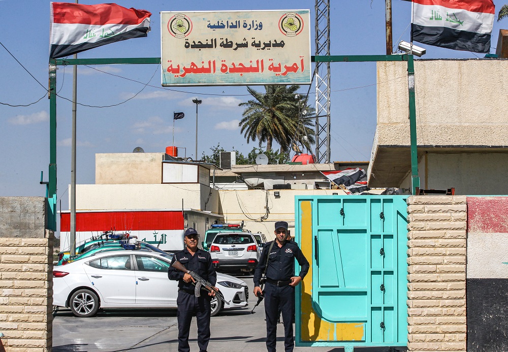 Iraqi policemen stand guard outside the river police headquarters by the Tigris in the centre of the capital Baghdad on May 10, 2019. u00e2u20acu201d AFP pic        