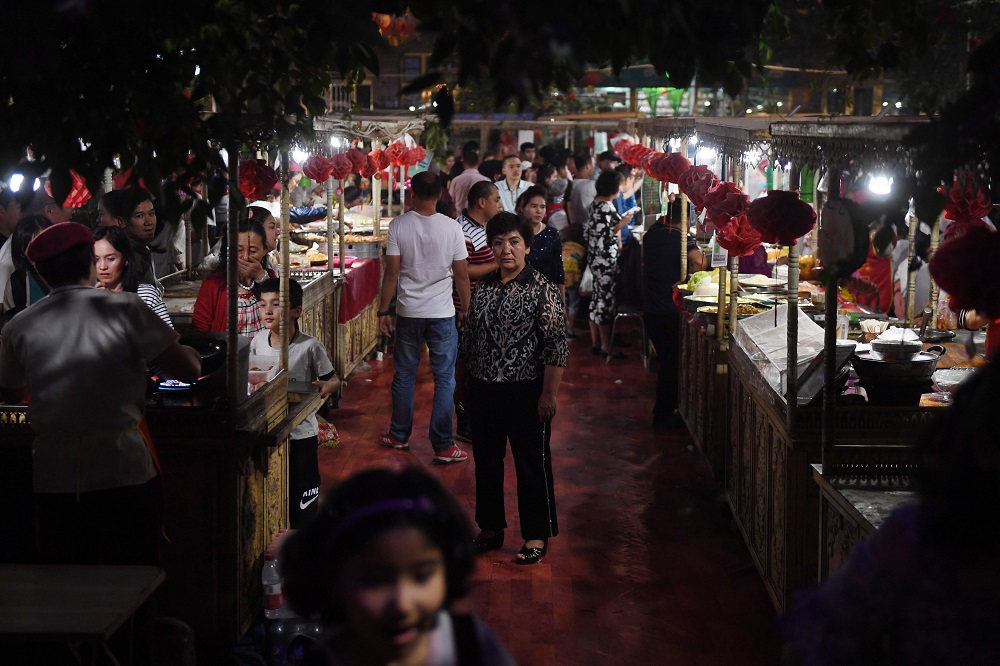 This photo taken on June 1, 2019 shows people at a night market in Kashgar, in Chinau00e2u20acu2122s western Xinjiang region. u00e2u20acu201d AFP pic        
