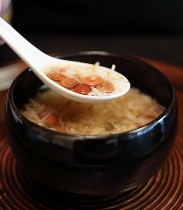 The restaurant’s signature 'nameko zousui' – rice congee made with gelatinous 'nameko' mushrooms