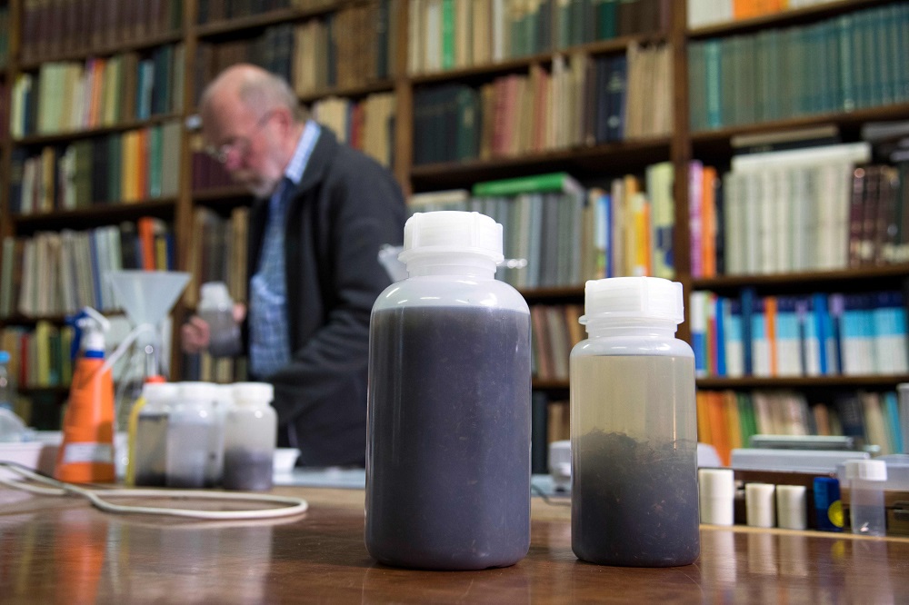 A picture taken on May 9, 2019 shows bottles of collected insects from insect traps 20 years ago and today at the home of the volunteer-run Entomology Society in Krefeld, western Germany. — AFP pic            