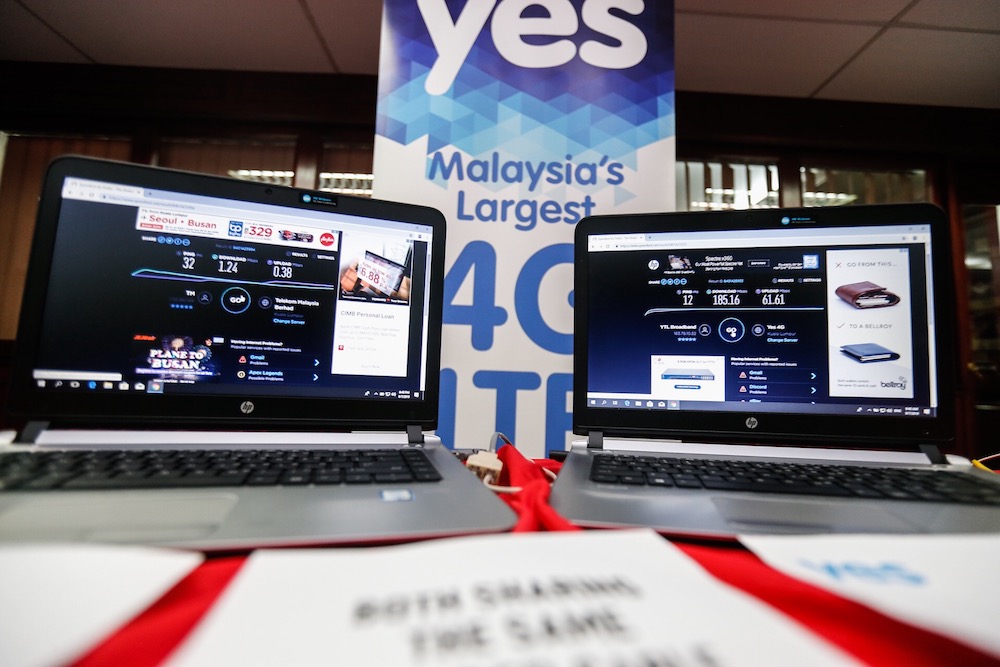 Two laptops are seen after an internet speedtest during the Pilot Project for Gigawire in George Town July 9, 2019. — Picture by Sayuti Zainudin