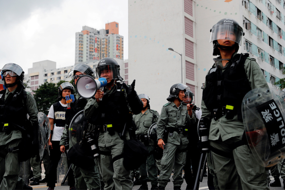 Riot police ask anti-extradition bill protesters to leave in front of public housing after a march at Sha Tin District of East New Territories,Hong Kong, China July 14, 2019. u00e2u20acu201d Reuters picnn