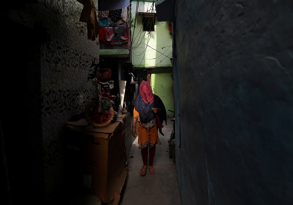 A woman walks through an alley in a residential area in New Delhi, India April 30, 2019. u00e2u20acu201d Reuters pic
