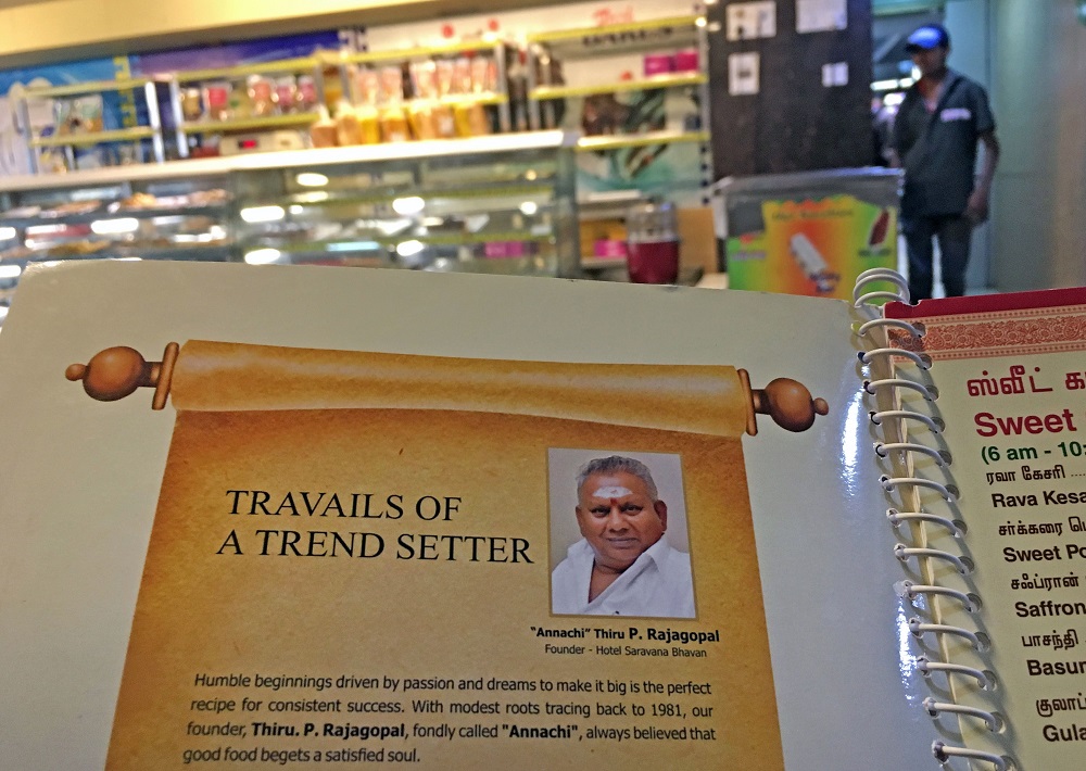 This photo taken on June 28, 2019 shows the image of P. Rajagopal, founder of the Saravana Bhavan food chain, on a menu at one of the popular restaurants in Chennai. u00e2u20acu2022 AFP pic            