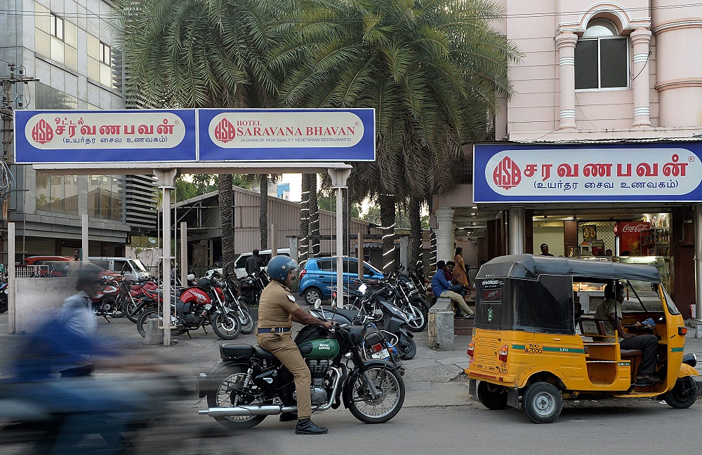 This photo taken on June 28, 2019 shows people outside a restaurant of the popular Saravana Bhavan food chain in Chennai. u00e2u20acu2022 AFP pic           