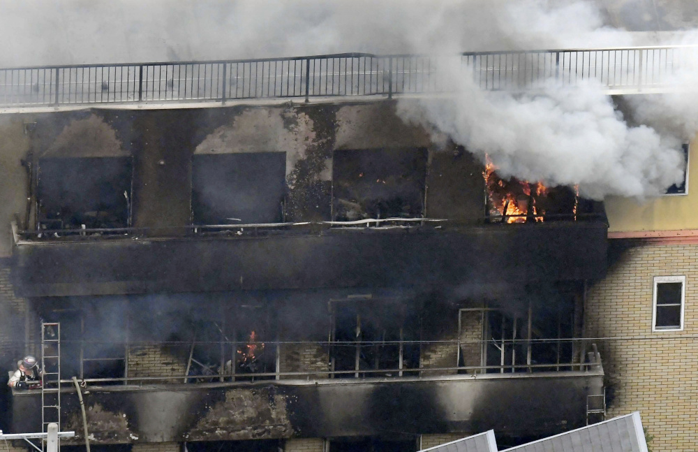 An aerial view shows smoke and flame rise from the three-story Kyoto Animation building which was torched in Kyoto, western Japan, in this photo taken by Kyodo July 18, 2019. u00e2u20acu201d Picture from Kyodo via Reuters 