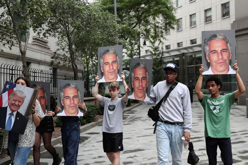 Demonstrators hold signs aloft protesting Jeffrey Epstein, as he awaits arraignment in the Southern District of New York on charges of sex trafficking of minors and conspiracy to commit sex trafficking of minors, in New York July 8, 2019. u00e2u20acu201d Reuters pic