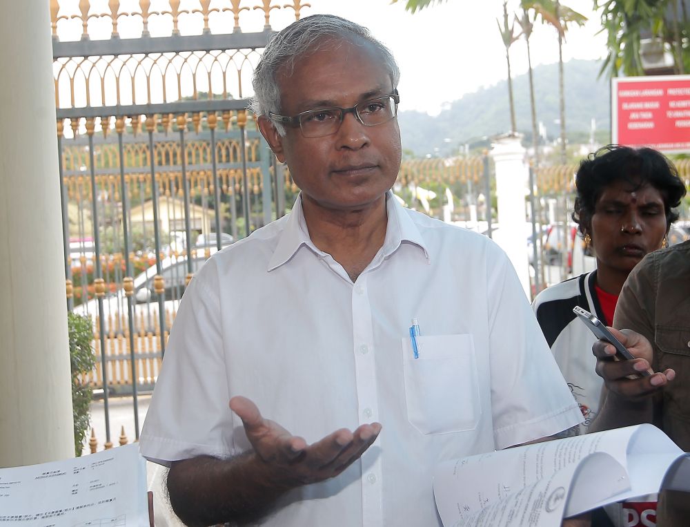 Parti Sosialis Malaysia chairman Dr Michael Jeyakumar Devaraj speaks to reporters at the entrance of the State Secretariat Building in Ipoh July 25, 2019. u00e2u20acu201d Picture by Farhan Najib