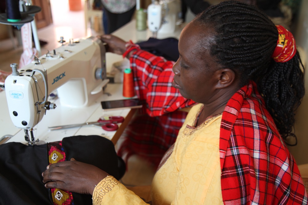 A refugee artisan sews fabric to make handbags for the MADE51 label at social enterprise Bawa Hope in Nairobi June 13, 2019. u00e2u20acu201d Thomson Reuters Foundation pic