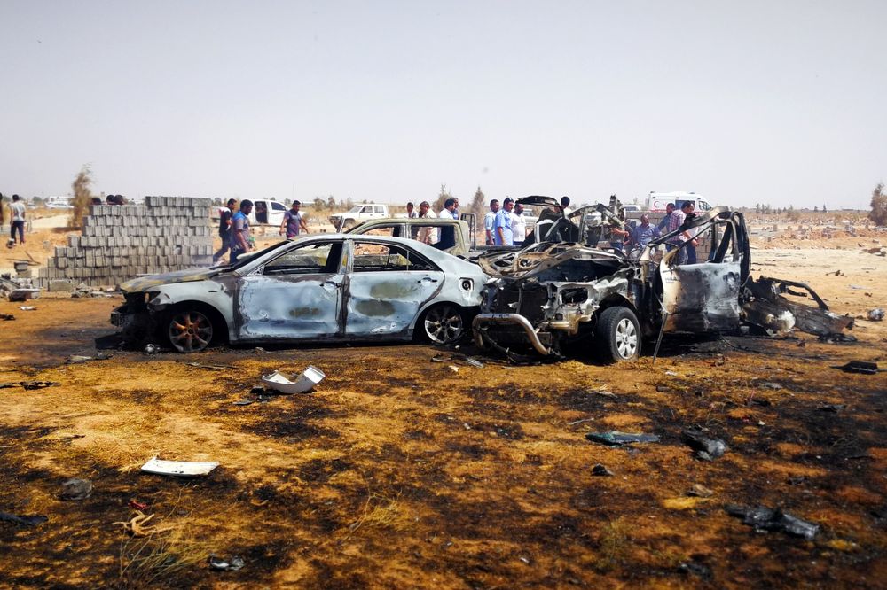 People gather at the site where a car bomb hit a funeral of a former senior military commander at Huwari cemetery in Benghazi, Libya July 11, 2019. u00e2u20acu201d Reuters pic