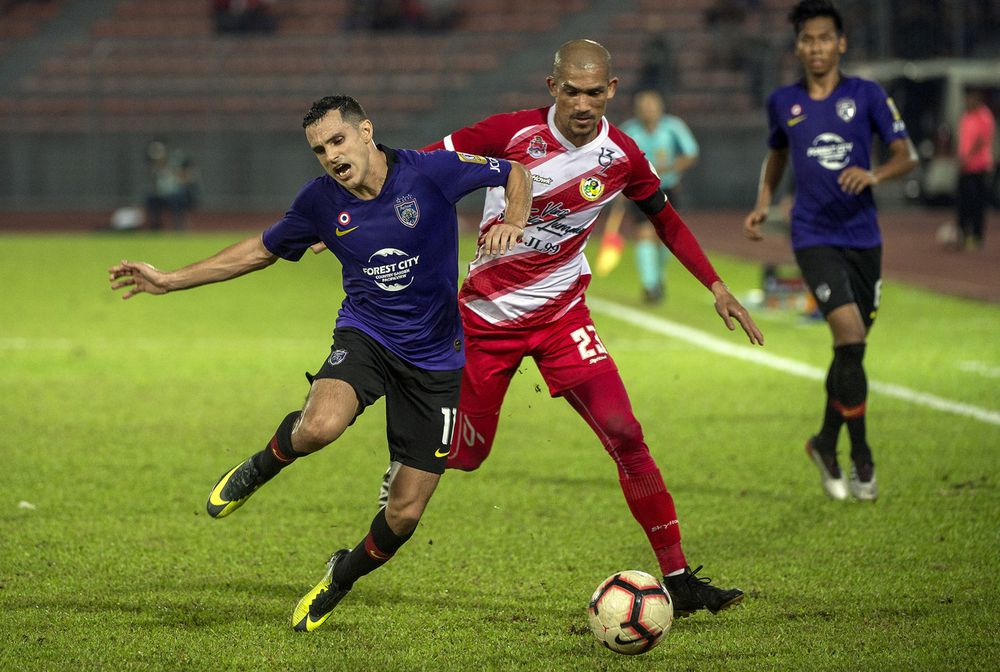 Johor Darul Tau00e2u20acu2122zim Gonzalo player Gabriel Cabrera Giordano being tackled roughly by Kuala Lumpur player Indra Putra Mahayuddin (front right) in their 2019 Super League match at the Kuala Lumpur Football Stadium in Cheras, July 13, 2019. u00e2u20acu201d Bernama pic