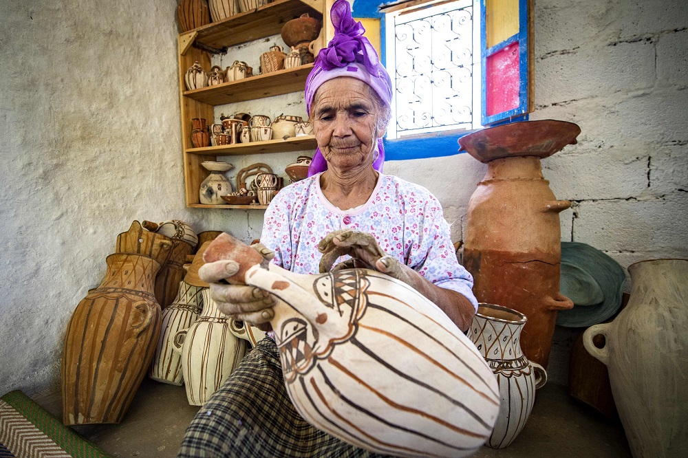 Moroccan potter Aicha Tabiz, also known as Mama Aicha, holds one of her works near the village of Ourtzagh in the foothills of the Rif mountains June 12, 2019. u00e2u20acu201d AFP pic       