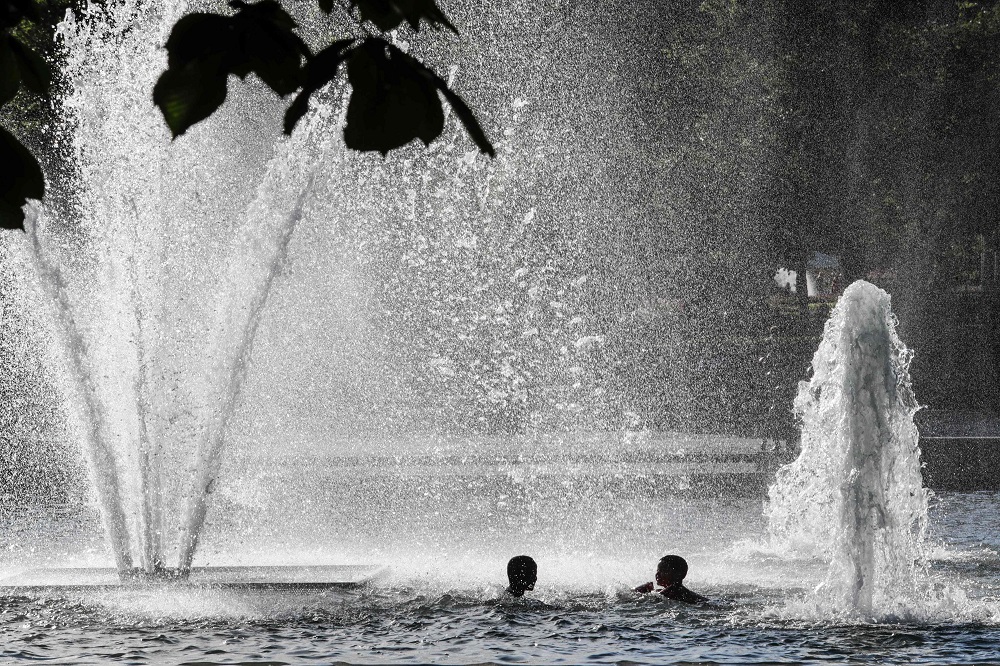 Children cool down in the fountain at Spikersuppa in Oslo as the heat reaches the Norweigan capital July 24 2019. u00e2u20acu201d AFP pic