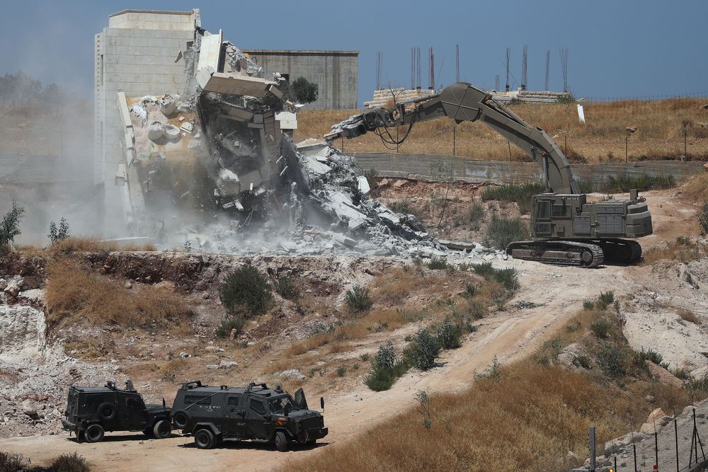 Israeli military machinery demolishes a Palestinian building in the village of Sur Baher which sits on either side of the Israeli barrier in East Jerusalem and the Israeli-occupied West Bank July 22, 2019. u00e2u20acu201d Reuters pic