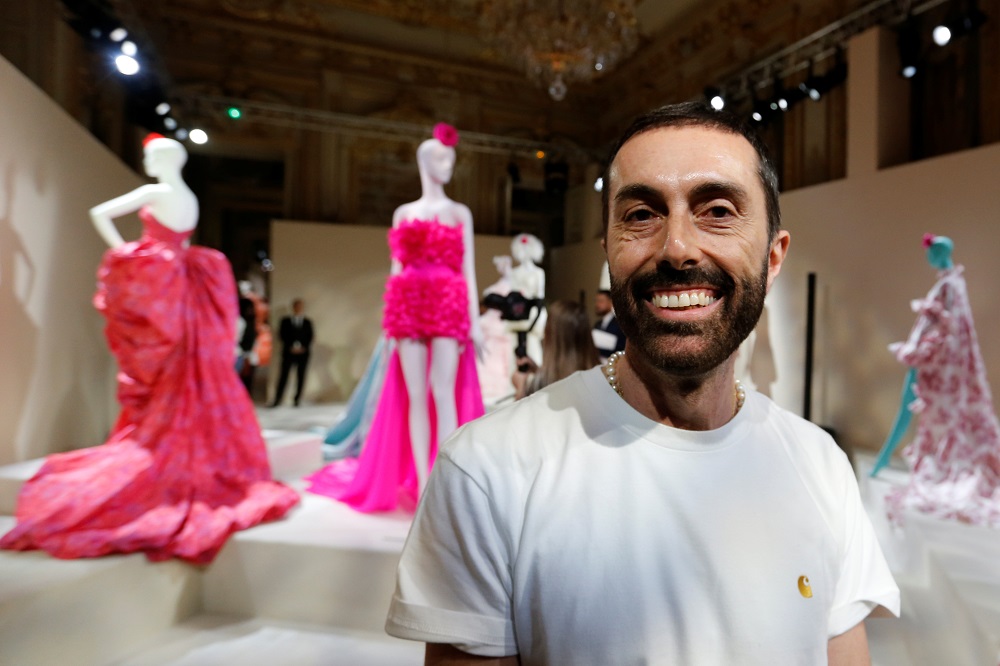 Designer Giambattista Valli poses next to creations displayed during an exhibition as part of his Haute Couture Fall/Winter 2019/20 collection presentation in Paris July 1, 2019. — Reuters pic        