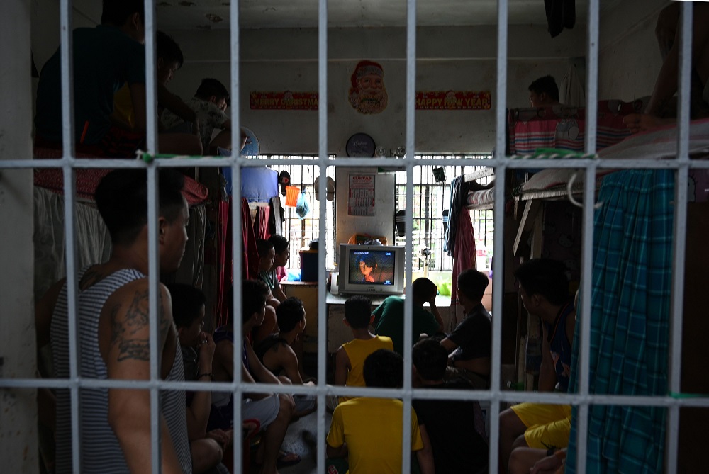 In this photo taken on May 21, 2019, minors being held at a juvenile detention centre watch television in Malolos town, Bulacan province, north of Manila. u00e2u20acu201d AFP pic        