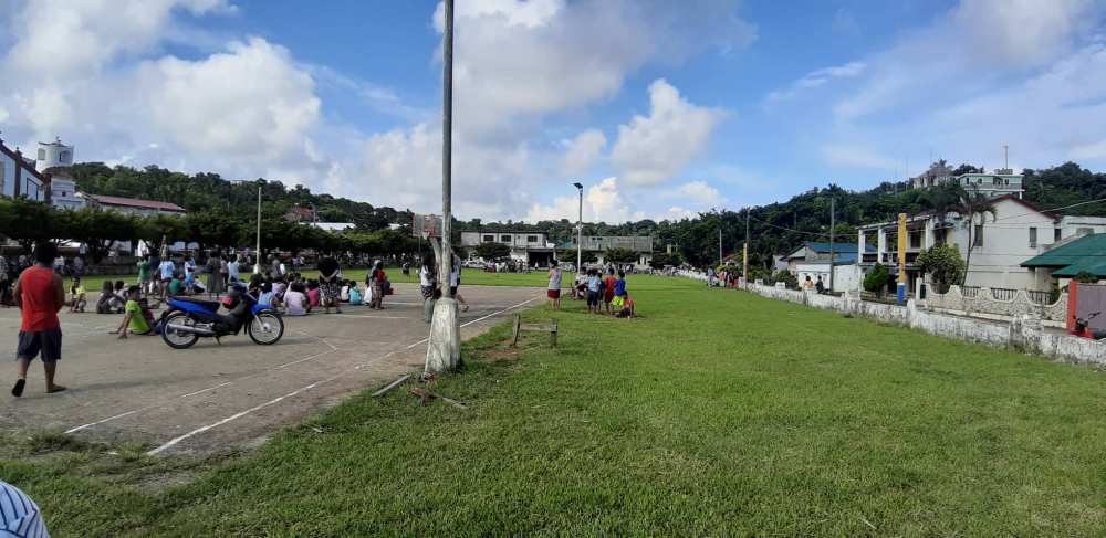 People gather on a field after an earthquake struck the Batanes Province, in northern Philippines, July 27, 2019, in this photo obtained from social media. u00e2u20acu2022 Picture by Edna Gato via Reuters