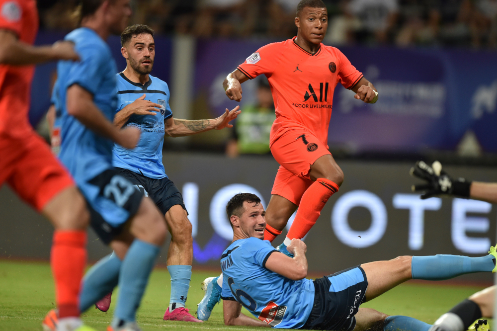 Paris Saint Germainu00e2u20acu2122s Kylian Mbappe (top) kicks the ball to score against Sydney FC at Suzhou Olympic Sports Centre Stadium during the International Super Cup in Suzhou, Jiangsu province July 30, 2019. u00e2u20acu201d AFP pic