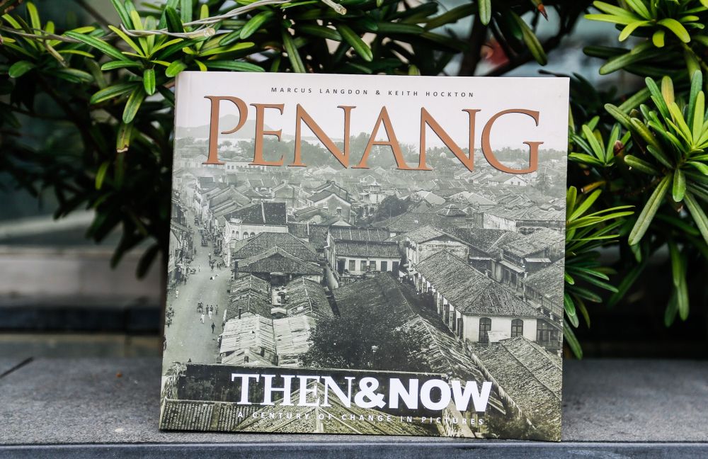 A copy of Marcus Langdonu00e2u20acu2122s u00e2u20acu02dcPenang, Then And Nowu00e2u20acu2122 is pictured at Avenue Mall, George Town July 2, 2019. u00e2u20acu2022 Picture by Sayuti Zainudin