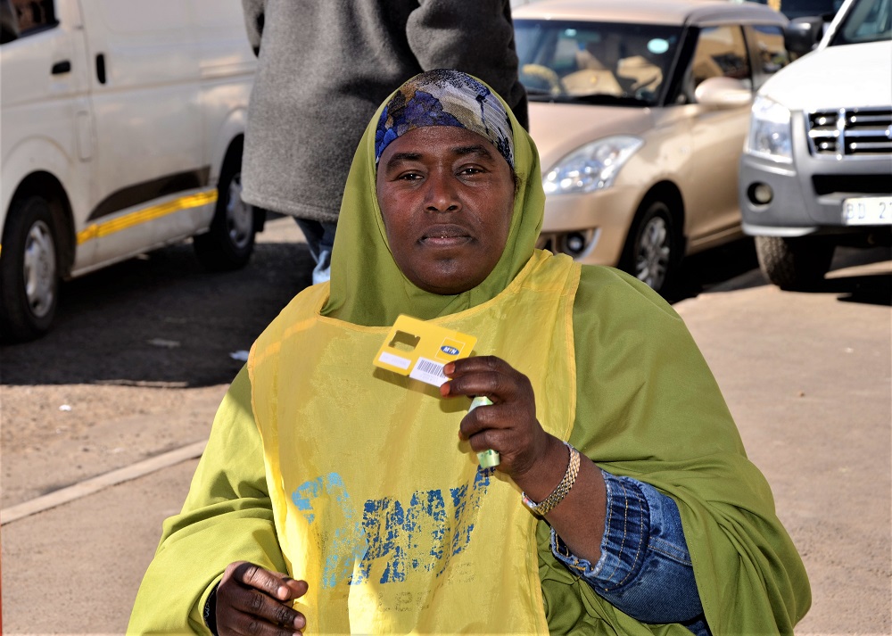 Halima Jawahir sells airtime to supplement her income from renting in Mayfair, South Africa June 3, 2019. u00e2u20acu201d Thomson Reuters Foundation pic