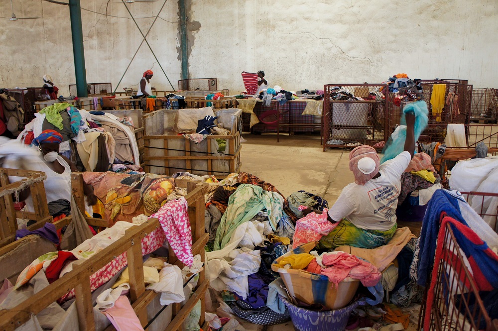 Workers of a recycling centre of second-hand textile of the French social enterprise u00e2u20acu02dcLe Relaisu00e2u20acu2122 sort through bales of clothes in Diamniadio, Senegal June 25, 2019. u00e2u20acu201d AFP pic            