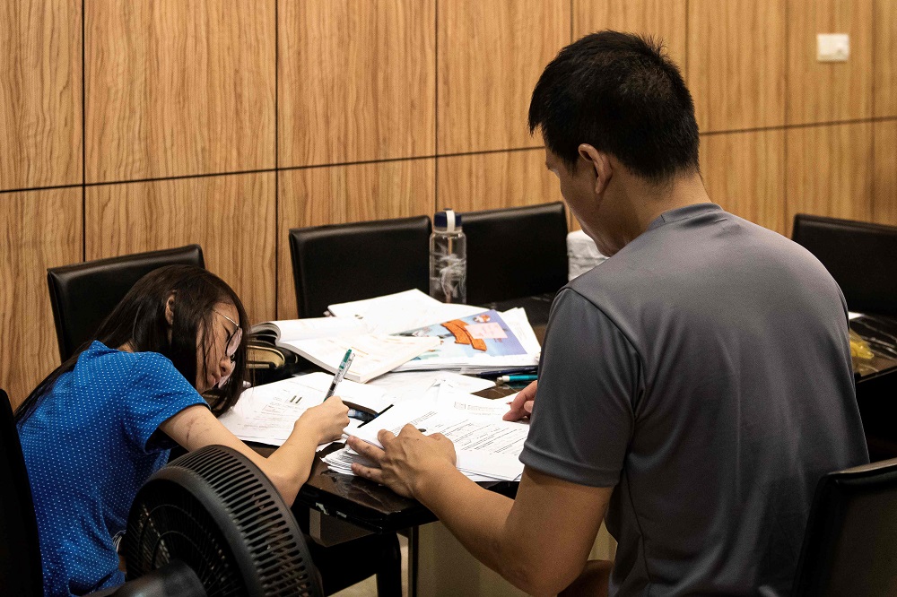 This photo taken on May 14, 2019 shows a Singapore student studying with a tutor from her home in Singapore. u00e2u20acu2022 AFP pic           