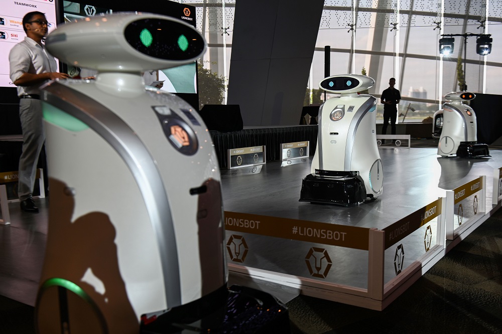 This picture taken on July 17, 2019 shows autonomous cleaning robots moving on a platform during a launch in Singapore. u00e2u20acu201d AFP pic           